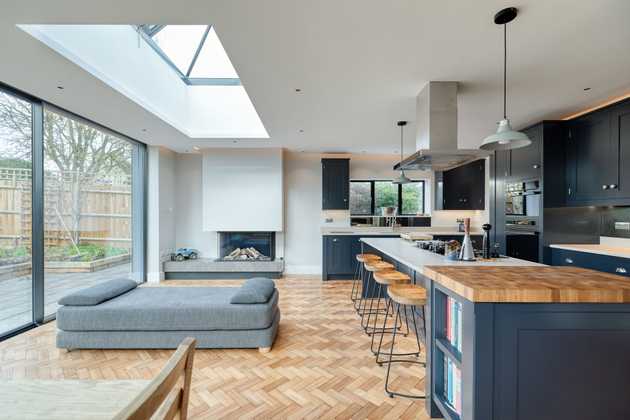 Modern black kitchen with kitchen island and big windows